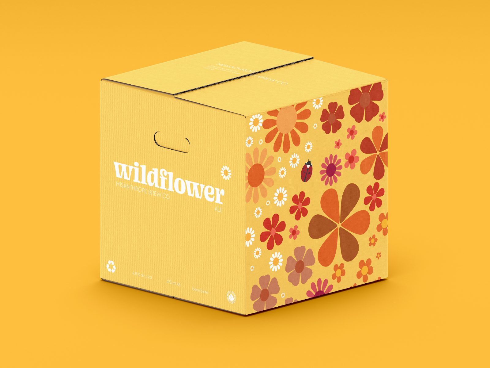 Yellow beer box, 2 sides are flower pattern with oranges and yellows and the other are plain yellow with the logo.