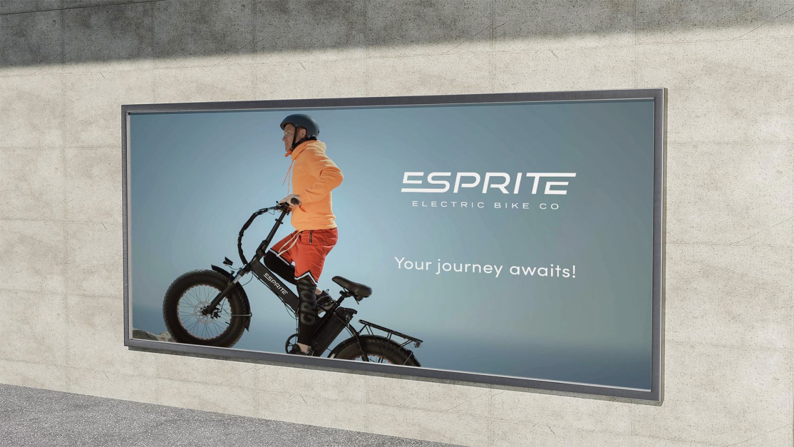 This billboard for ESprite highlights the electric bikes with a man riding one of the models. The bike has the white ESprite logo on it, and beside it is the ESprite tagline “Your journey awaits.”