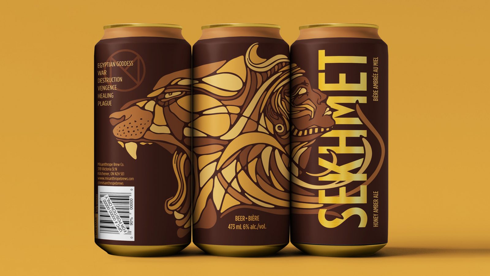 A set of three beer cans placed side-by-side display a design based off of Sekhmet, the Egyptian Goddess of war and healing. An illustration spreads across the surface of the can depicting the goddess’s face and a lion’s face amid swirling, interconnecting lines. The illustration uses dark brown line work and is coloured similarly to a mosaic in two shades of yellow and two shades of brown. Large sans serif type that reads “Sekhmet” is stacked vertically and intertwined with the design. The golden metal of the can shines through the type. The background is dark brown with a tan ring along the top of the can. Misanthrope’s brand logo is placed above and to the left of the illustrated lion’s head. The logo is a customized ‘M’ within a circle, coloured brown to match the can’s design. Left aligned text overlays the logo in yellow, listing six traits associated with the goddess: Egyptian goddess, war, destruction, vengeance, healing, and plague. The three cans are displayed against a golden yellow background.