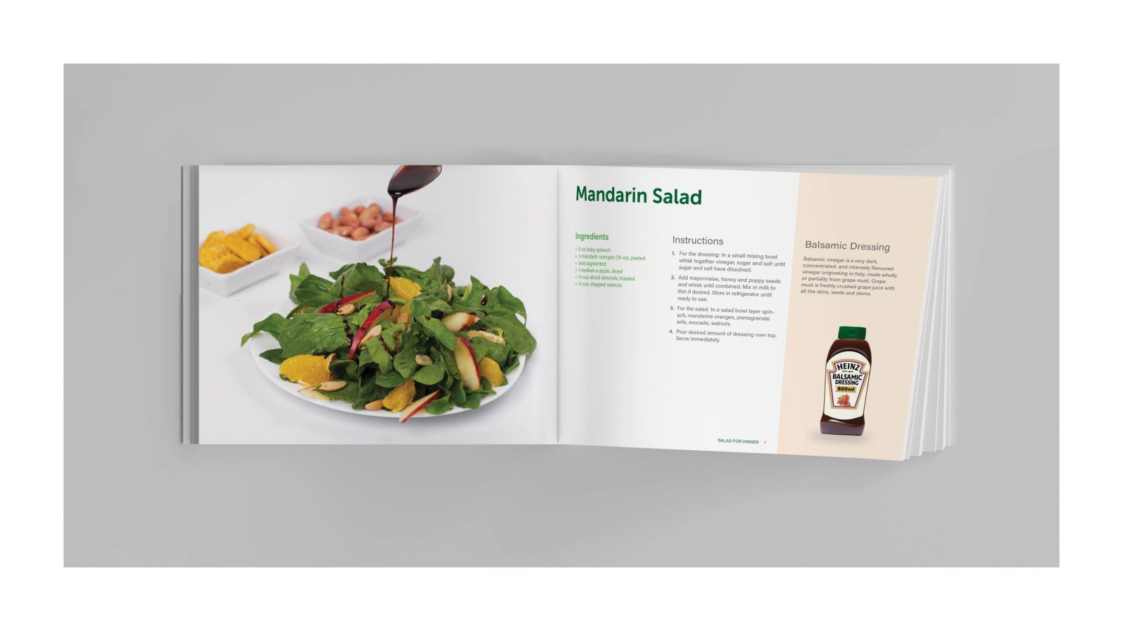 The image shows 2 pages of the salad for dinner magazine. On the left page there is a plate of salad that is in green and yellow and a spoon above it that the sauce is dripping from the spoon to the salad in white background. On the right page there is a text in black and green about mandarin salad, and there is a pink strip on the right side of the page and there is a small package of sauce on that side ribbon.