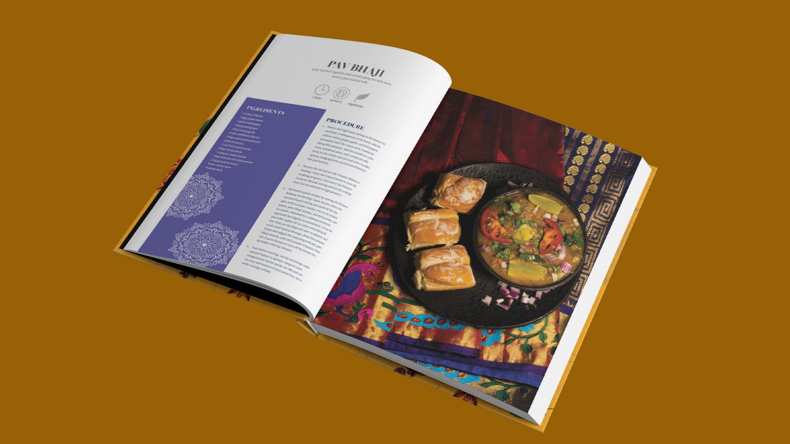 A recipe spread from the book Aanchal: The Hidden Secrets of Indian Foods and Sarees. On the left side the recipe of the popular snack Pav Bhaji from the Indian state of Maharashtra is shown, with a colourful and patterned sidebar that displays the ingredients with the recipe instructions on the other side. At the top is the name of the recipe, a brief description in italics of what it is, how long it takes to cook, the serving size, and whether or not it is vegetarian. On the right side is a photograph of a rich chickpea curry garnished with tomatoes, red onions, limes, and parsley sitting atop a purple and gold saree adorned with red, blue, and lilac embellishments.