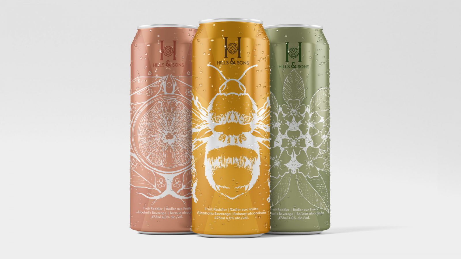 Three craft-raddler designed cans sitting beside each other. From left to right. Hills and Sons Grapefruit raddler, Hills and Sons Honey Raddler, Hills and Sons Pear raddler.