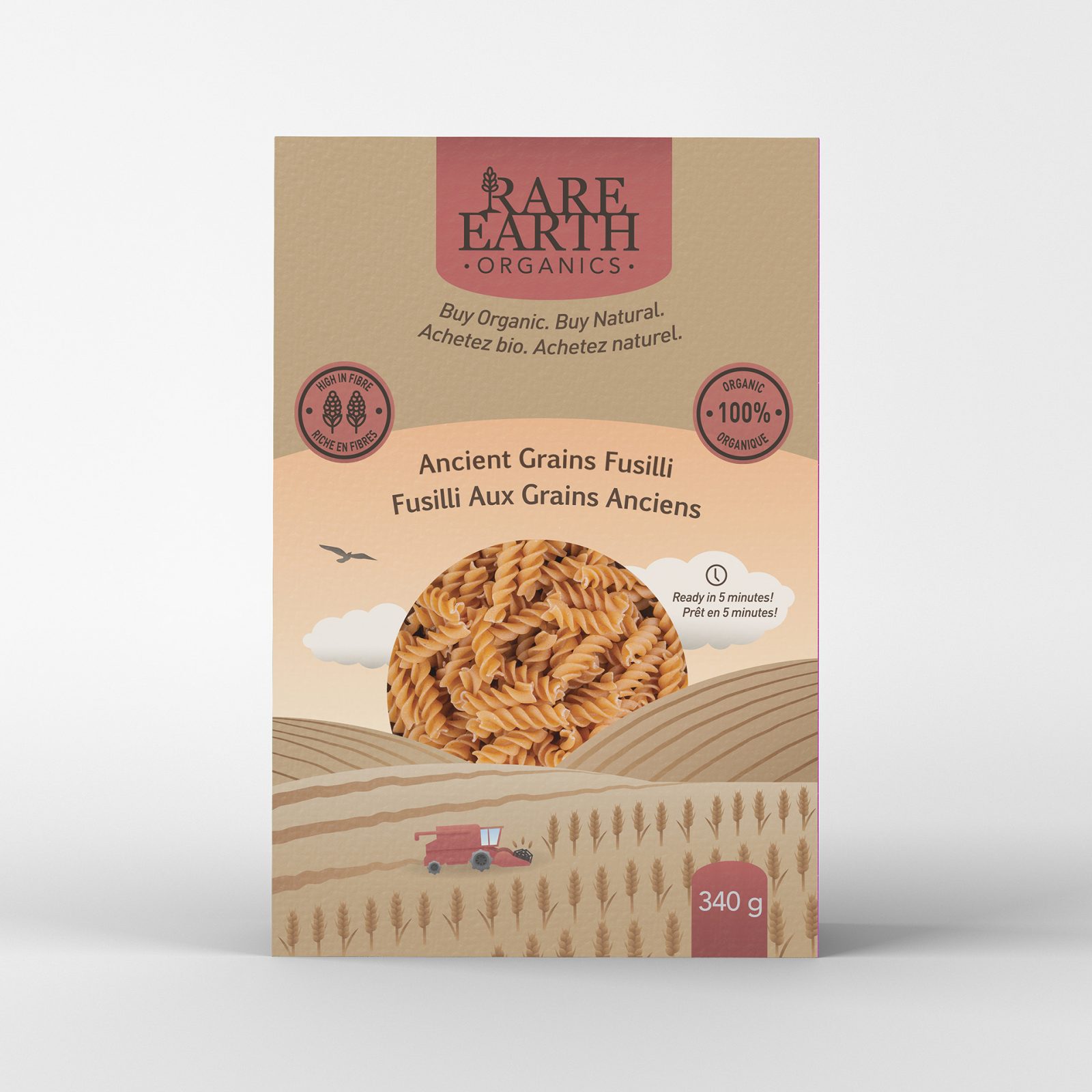 A “Rare Earth Organics” branded ancient grains pasta box that features are of a combine harvesting grains at sunset, with a window making up the sun.