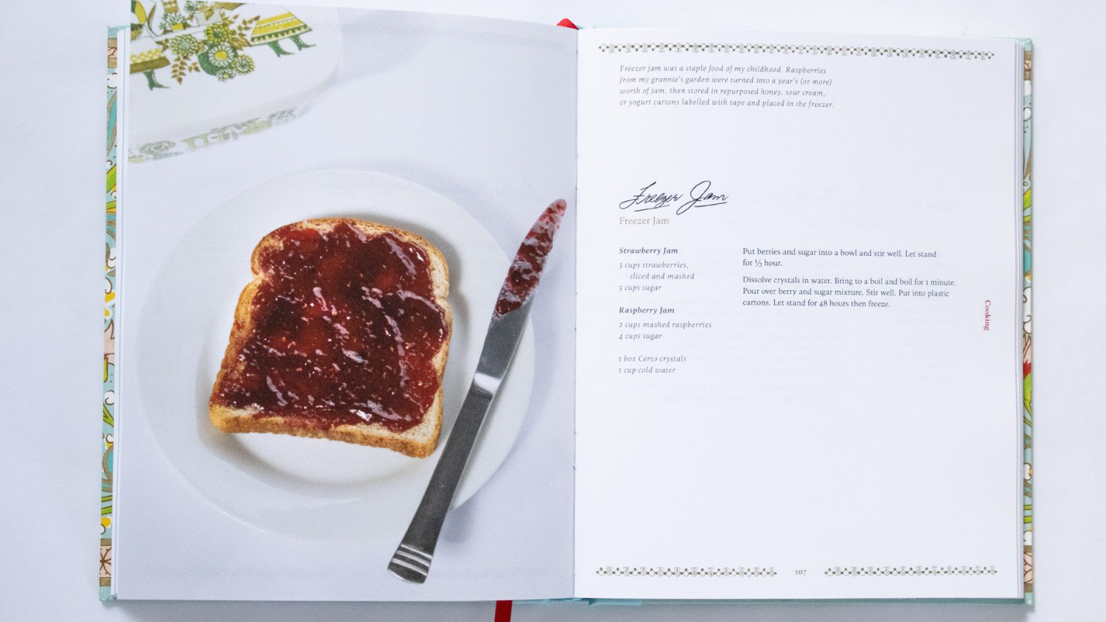 An open cookbook spread with a photograph of jam on toast and with the recipe on the opposite page.