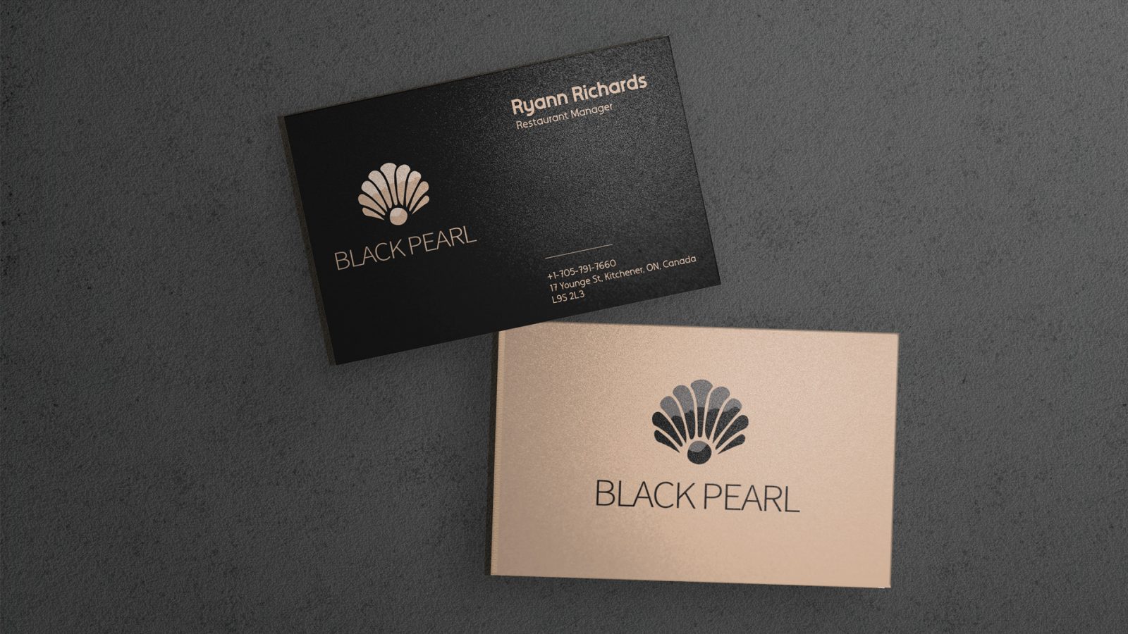 A glossy “Black Pearl” cream and midnight black business card. The type is very sleek and clean, highlighting the logo and typeface in assorted colours and sizes.