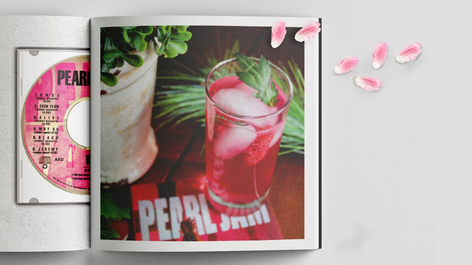 This is the first inside spread of the “CD’s and Cocktails” pairing book. This book serves recipes for cocktails that are paired with various CD’s. The first image is Pearl Jams “Black” album.